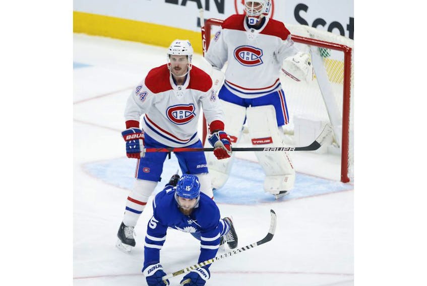 Montreal Canadiens Joel Edmundson D (44) crosschecks Toronto Maple Leafs Alexander Kerfoot C (15) for a two minute penalty during second period action in Toronto on Thursday May 6, 2021. Jack Boland/Toronto Sun/Postmedia Network