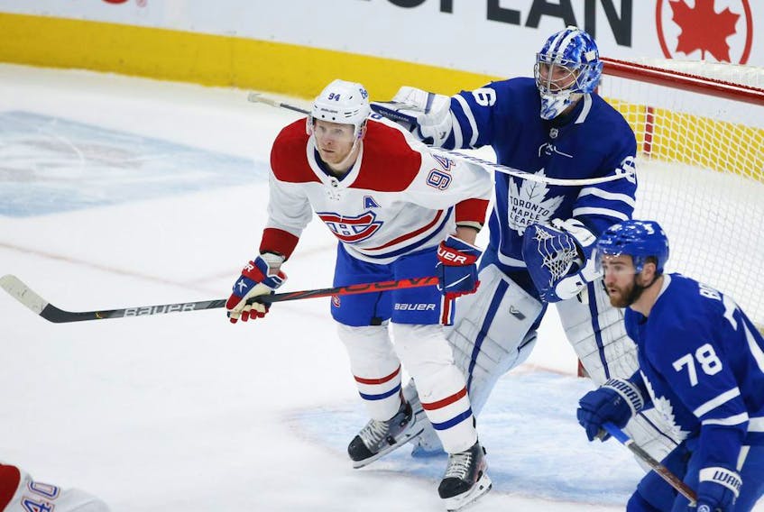 Montreal Canadiens Corey Perry LW (94) and Toronto Maple Leafs Jack Campbell G (36) get into it in front of the net during first period action in Toronto on Thursday May 6, 2021. Jack Boland/Toronto Sun/Postmedia Network