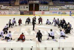 Head coach Jim Hulton, centre, addresses his Charlottetown Islanders on the Eastlink Centre ice for the final time on Wednesday. The team is in Shawinigan, Que., where they will play Game 1 of the Quebec Major Junior Hockey League’s Maritimes Division final tonight.