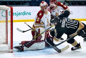 Charlottetown Islanders captain Brett Budgell beats Acadie-Bathurst Titan goalie Jan Bednar Saturday for the first goal of the Maritimes Division final in Shawinigan, Que. – Olivier Croteau