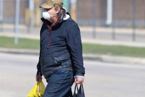 A person wears a mask in public, in Winnipeg on Friday, May 7, 2021.