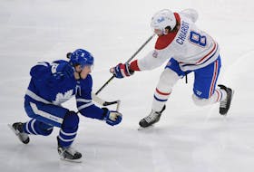 Maple Leafs forward Mitch Marner (left) blocks a shot by Montreal Canadiens defenceman Ben Chiarot on Saturday at Scotiabank Arena. Team defence has helped propel Toronto to the North Division title.