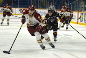 Cheticamp’s Lane Hinkey, left, and the Acadie-Bathurst Titan are currently playing the Charlottetown Islanders in the Quebec Major Junior Hockey League Maritime Division. The Titan advanced to the division final winning the New Brunswick playoff round robin last week. JEREMY FRASER/CAPE BRETON POST