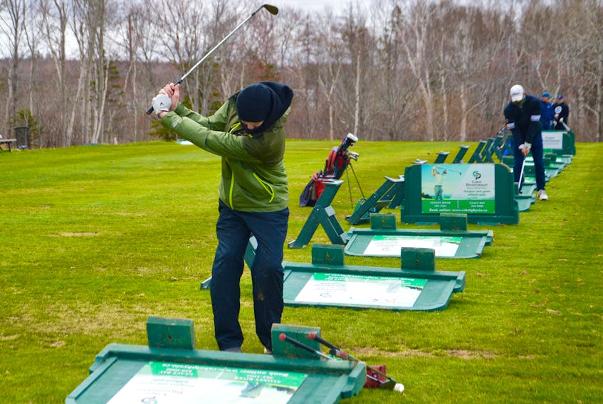 Almost unrecognizable without his pads, mask and stick, well-known local goaltender Jack Cashen already appears to be in mid-season form as he hits some balls at the driving range of the Lingan Golf Club. The 18-year-old New Waterford native, who spent the past two seasons with the Sydney Mitsubishi Rush of the Nova Scotia U18 Hockey League and was drafted by the QMJHL’s Cape Breton Eagles, has a summer job at Lingan. Cashen said the course is in great shape and he’s looking forward to some better weather. DAVID JALA/CAPE BRETON POST