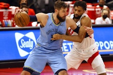Memphis Grizzlies centre Jonas Valanciunas drives to the basket against Toronto Raptors centre Khem Birch on Saturday.