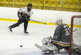 Forward Jonah MacDonald watches as goalie George Gallant makes a save on his shot during the first period of Monday’s Charlottetown Bulk Carriers Knights intrasquad game. It was part of the major under-18 hockey team’s identification camp at MacLauchlan Arena in Charlottetown. There are about 45 players in camp. MacDonald played for the Mount Academy Saints under-17 team in 2020-21 while Gallant played for the Prince County Warriors under-15 squad. MacDonald and his Team White teammates won 4-2 Monday in a game that consisted of two 30-minute periods. Grey led 1-0 after the first period, but White scored four times in the second period. Mike Arsenault, Caleb MacDonald, Sam Bowness and Holden Bradley scored in the win. Jonah MacDonald and Kal White each had two assists while singles went to Caleb MacDonald, Finn Morris and Cam MacLean. Landon MacKinnon stopped six of seven shots in the first period while Jack Howatt turned aside 16 of 17 shots in the second period. Colby Huggan and Matt MacDonald replied with power-play goals for Grey. Isaac Vos, Alex Campbell, Jonah Jelley and Huggan each had an assist. Gallant stopped all 20 shots he faced while Kiefer Thompson stopped 18 of 22 shots he faced.
