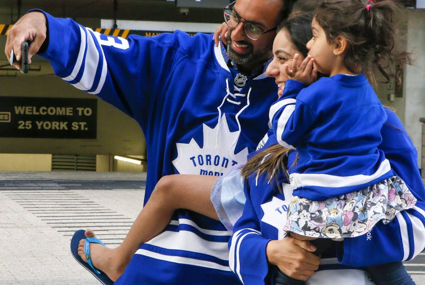  Leaf fans take a selfie outside of the entrance at the Scotiabank Arena on Monday, May 31, 2021. VERONICA HENRI/TORONTO SUN