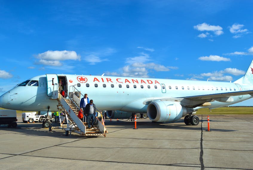 Air Canada has further delayed the resumption of its Sydney flights to and from Halifax and Montréal. Above, passengers make their way down the stairs from an Air Canada flight at the J.A. Douglas McCurdy Sydney Airport. CAPE BRETON POST FILE