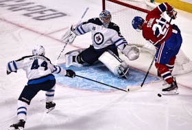 Winnipeg Jets goalie Connor Hellebuyck — shown making a save against Montreal Canadiens’ Eric Staal (21) earlier this season — was once a familiar face to St. John’s hockey fans. He was an AHL all-star during his last year as a St. John’s IceCap. The Jets face the Canadiens in Game 1 NHL's North Division final  tonight. USA TODAY Sports File photo