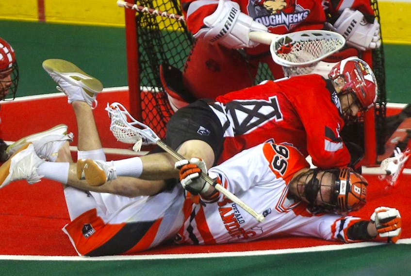 The Calgary Roughnecks' Jesse King battles the Buffalo Bandits' Chase Fraser in Game 2 of the 2019 NLL  Finals at the Scotiabank Saddledome  in this photo from May 25, 2019.