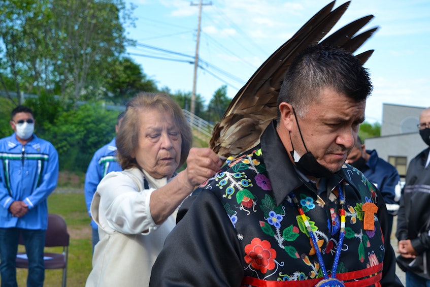 Eskasoni elder, Lottie Johnson performs a smudging ceremony for the community's newly elected council and chief, Leroy Denny, pictured. ARDELLE REYNOLDS/CAPE BRETON POST