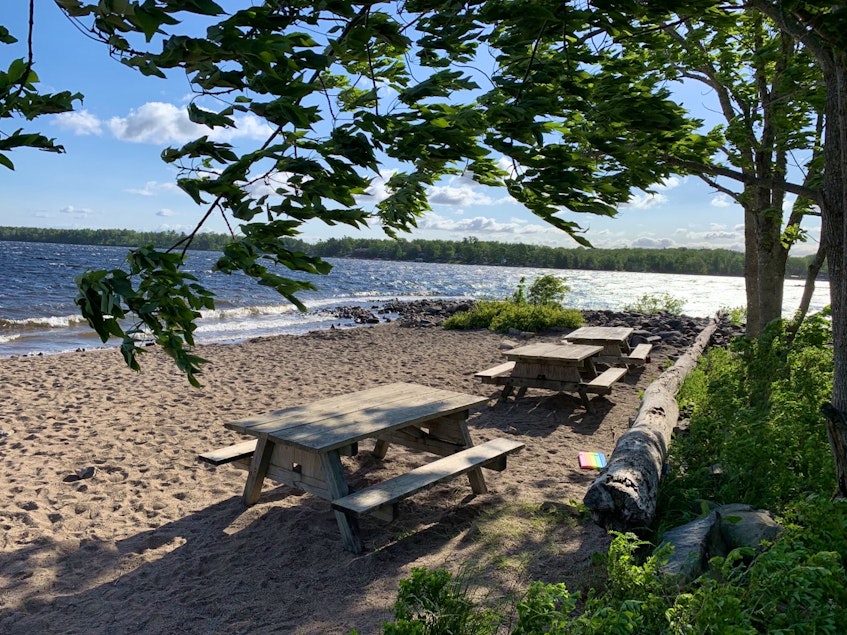 A beach at Oakfield Park, on Grand Lake, was devoid of people on June 10, 2021 after an emergency alert issued that morning warned people not to drink, or even touch or boat on, water from the lake following a suspected case of blue-green algae. FILE