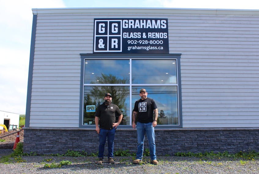 Manager Paul Bates (left) and owner Graham Hayden (right) outside Graham's Glass & Renos in Stellarton, which recently opened a retail office and showroom.