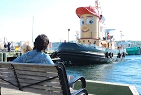 Fans of Theodore TOO, the friendliest face on the Halifax waterfront, gathered to say farewell to the smiling tugboat as he left port for his new home in Hamilton on Thursday morning.