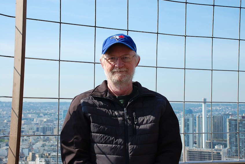 Doug McGee, former associate editor of the Cape Breton Post, travelled with his wife upon retirement. This photo was taken atop the Effiel Tower in Paris in April 2015. McGee died Friday at age 71.