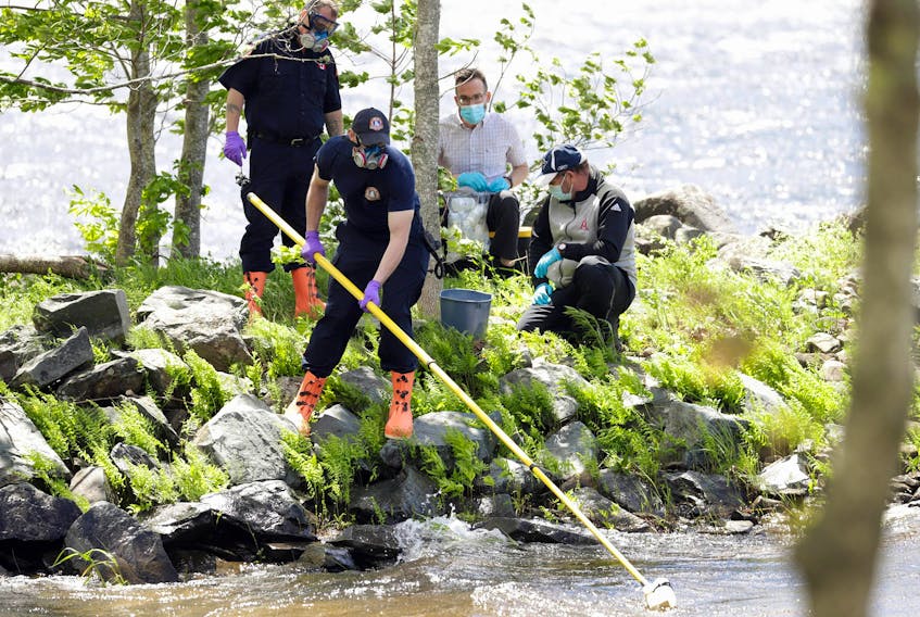 Staff from the Department of Environment and Climate Change, assisted by members of Halifax Regional Fire & Emergency, Grand Lake Station, take water samples from Grand Lake Thursday, June 10, 2021, to test for toxins.