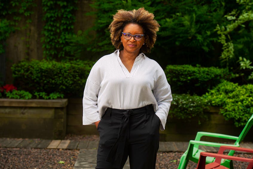 Claudine Bonner, a sociology professor at Acadia, poses for a photo in a courtyard outside her Halifax condo on Friday, June 11, 2021. Bonner says most people in Canada don't know enough about Black communities, the history of Black presence in the country, as well as what the experience of Black Canadians have been and continue to be.