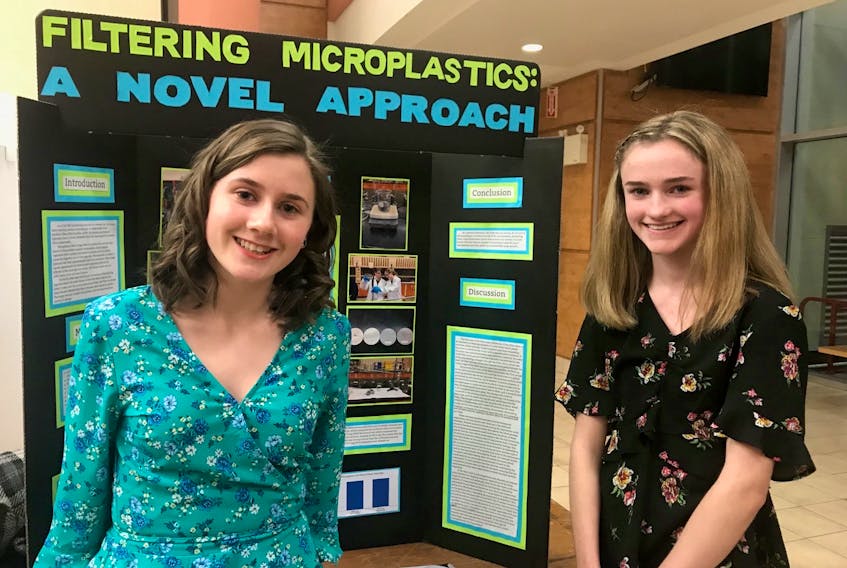 Mary MacInnis, right, and her science fair partner Julia Jamael, beside their science fair project in grade 10. MacInnis was one of 100 students across Canada to be awarded a 2021 Schulich Leaders Scholarship. CONTRIBUTED  