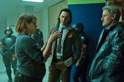Director Kate Herron talks to Tom Hiddleston and Owen Wilson on the set of Loki.