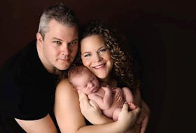 Stephen and Stephanie Ryan cuddle their son, Dominic. The Conception Bay South, NL couple faced a tough journey to parenthood as they worked together to overcome male infertility. Their dream recently came true with their baby's safe arrival.