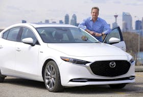 Brian Smith with the 2021 Mazda3 100th Anniversary Edition he drove in and around Calgary for a week.  Darren Makowichuk/Postmedia News