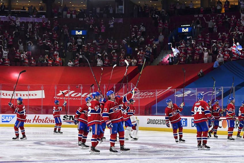 Canadiens players salute the fans following their 3-2 overtime victory against the Jets to close out the North Division series on Monday. 