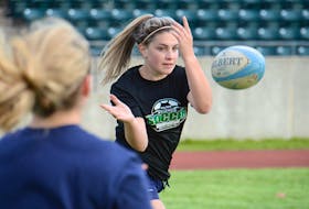 Emma Langley tosses the ball to a teammate during a passing drill Friday at UPEI.