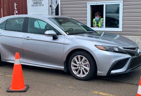 A vehicle stops at the Nova Scotia entrance control point at the N.B. border. Nova Scotia has imposed new vaccination and isolation measures for New Brunswick visitors while opening up to Prince Edward Island and Newfoundland and Labrador with no strings attached. - File