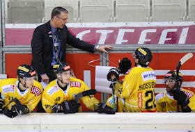 Vienna Capitals head coach Dave Cameron talks to his players during a game in the International Central European (ICE) Hockey League. Cameron, who resides in Kildare Capes, will return to the Capitals for a fourth season in August.