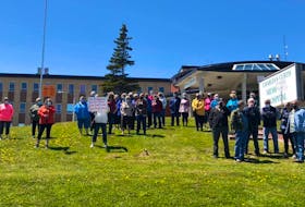 Residents of St. Anthony demonstrate outside the Charles S. Curtis Memorial Hospital Monday after hearing about temporary cutbacks in services due to staffing shortages. Facebook photo