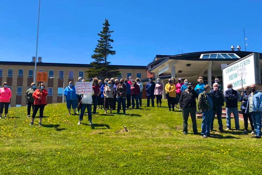Residents of St. Anthony demonstrate outside the Charles S. Curtis Memorial Hospital Monday after hearing about temporary cutbacks in services due to staffing shortages. Facebook photo