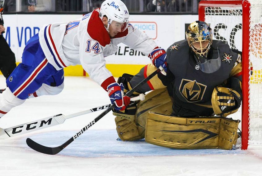 LAS VEGAS, NEVADA - JUNE 14:  Nick Suzuki #14 of the Montreal Canadiens trips over Marc-Andre Fleury #29 of the Vegas Golden Knights as he defends the net in the third period in Game One of the Stanley Cup Semifinals during the 2021 Stanley Cup Playoffs at T-Mobile Arena on June 14, 2021 in Las Vegas, Nevada. The Golden Knights defeated the Canadiens 4-1.