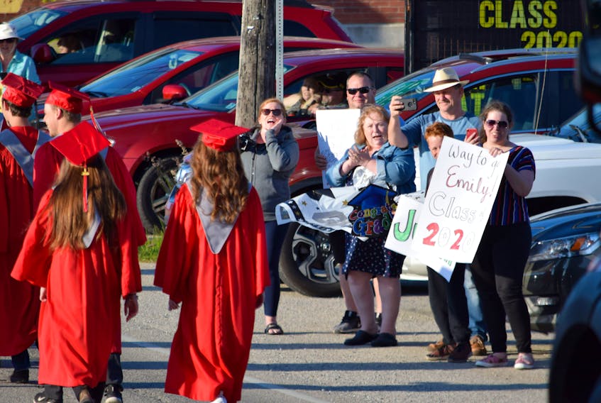 The BMHS Class of 2020 is cheered on by well-wishers as they parade through the Barrington Passage business district last year. Kathy Johnson

