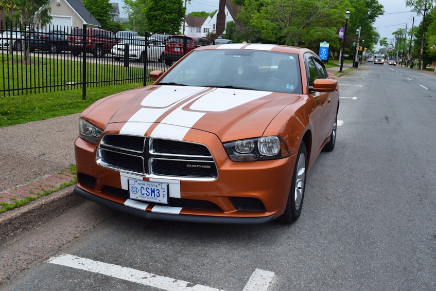 This orange Dodge Charger, which the family got following the fire, was going to become Lucas' car after he got his licence.  - Chelsey Gould