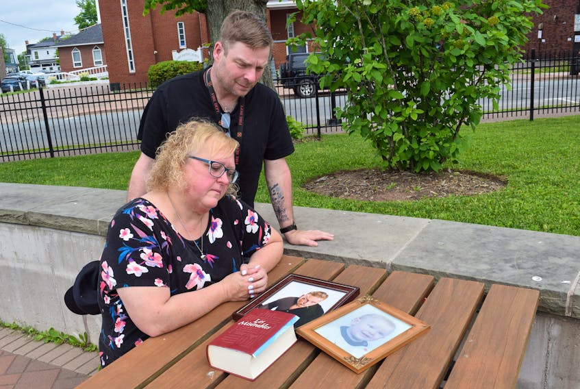 Laureen and Lewis Rushton look at photos of their son, Lucas, who passed away on May 31. They hope sharing Luca's story will help others struggling with mental health.
