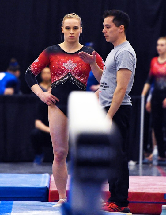 Coach David Kikuchi gives instruction to Ellie Black during the 2019 Artistic Gymnastics Canadian Championships in Ottawa. - Gymnastics Canada