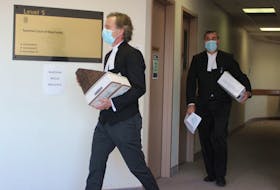 Crown lawyers Mark Donohue, left, and Constantin Draghici-Vasilescu entered a Sydney courtroom Thursday where they are prosecuting a Cape Breton mother and her three daughters in a $3.6 million tax fraud case. CAPE BRETON POST PHOTO