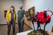  Jennifer Saleik, left, and her husband David Foy pose for a photo with some of their work at an exhibition at Contemporary Calgary on June 15, 2021. Azin Ghaffari/Postmedia