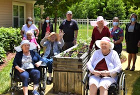 Members of the Garden Club and staff come together for a photo while surrounded by some of their green thumb handiwork. Pictured are Helen Dearman (back, left), Louela Paris, Wayne White, Shelly DeViller, Stephanie Miles, Jean Partridge (middle, left), Joan Dempsey, Edna Gregory, Elaine McNamara (front, left), and Loretta Sullivan.