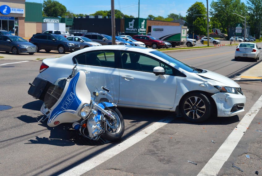 A collision involving a Charlottetown Police Services motorcycle and a white Honda Civic occurred on Friday, June 18, at the corner of Queen and Pond streets. Police had a section of Queen Street closed for the early part of the afternoon.