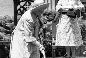 The Queen Mother, on the front lawn of the Memorial Library in Halifax on June 28, 1979, turns the sod for a sculpture of Winston Churchill that was scheduled to be placed at the library in the fall. Janet F. Kitz   looks on. - The Canadian Press