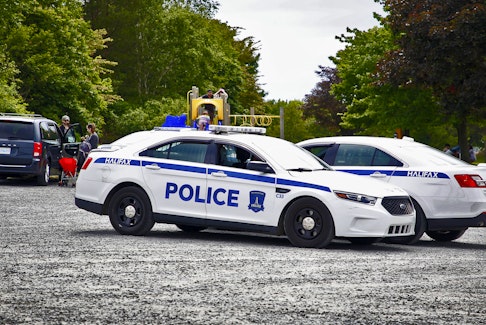 FOR CAMPBELL STORY:
A pair of Halifax Regional Police officers confer in their cars, in the parking lot of Africville Park in Halifax Saturday June 19, 2021....For Campbell story on BOPC subCommittee to define defunding the police story.
