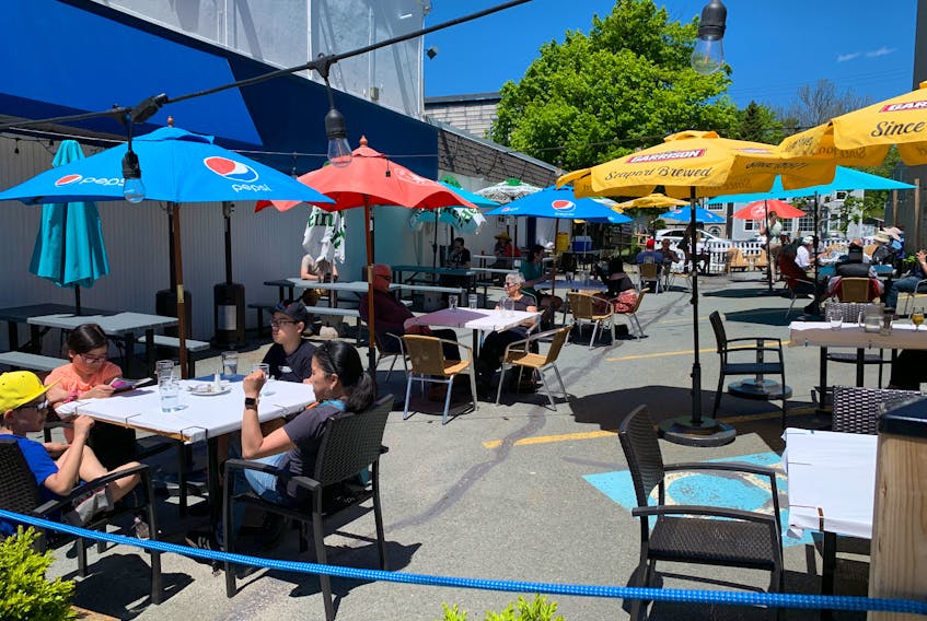 June 2, 2021 - Patrons enjoy a nice day outside Athens restaurant on Quinpool Road on Wednesday as Nova Scotia's COVID-19 restrictions eased to allow service outside.
