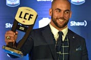  Edmonton long-snapper Ryan King holds up his Tom Pate Memorial Award won for contributions to his team, community and outstanding sportsmanship at the CFL Awards Gala in Edmonton on Nov. 22, 2018.