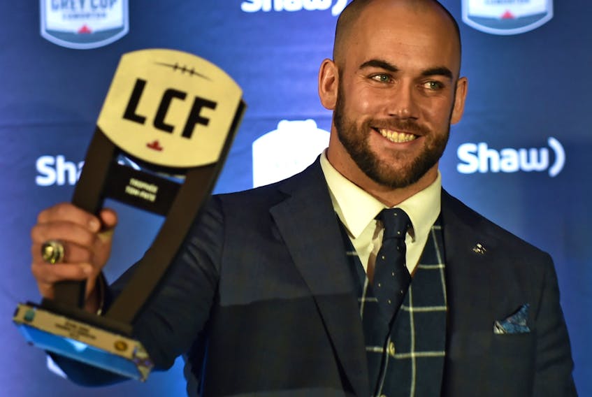  Edmonton long-snapper Ryan King holds up his Tom Pate Memorial Award won for contributions to his team, community and outstanding sportsmanship at the CFL Awards Gala in Edmonton on Nov. 22, 2018.