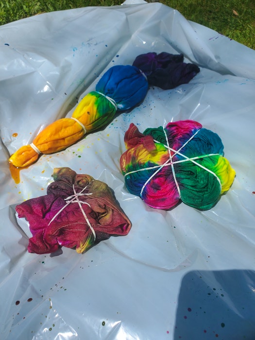 The first step when tie-dying, says Kayla Barkhouse, is to dampen the item you are dying. Then, twist, spin, fold or do all three to the shirt. Add elastics to hold the folds in place, then start adding your colour. - Contributed