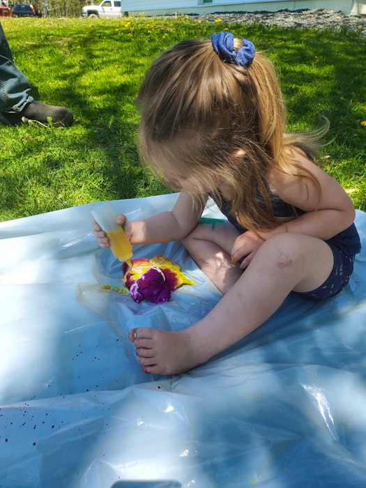 Even small kids can get involved with tie-dying clothing and other fabric items - just prepare for some mess. Three-year-old Rosie Barkhouse has fun with a project. - Contributed