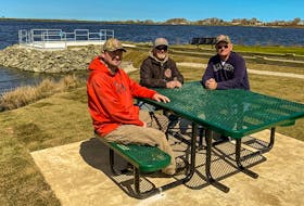 From left to right, Port Morien Wildlife Association members Jeff McNeil, Stan Peach and Brian McNeil at the barrier-free accessibility fishing site that PMWA built in Glace Bay. CONTRIBUTED