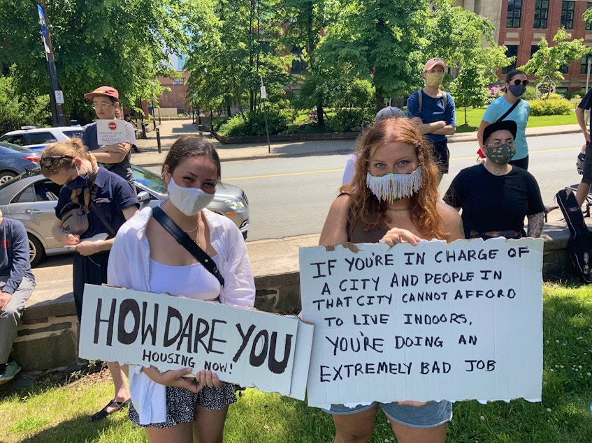 University students Katherine Pindera, left, and Anna Gaudet attended Sunday’s rally addressing homelessness in Halifax. They say governments can no longer wait to address the affordable housing crisis in the city. - Andrew Rankin