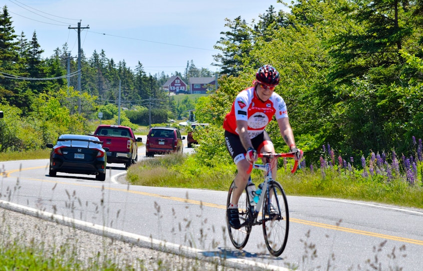 Simon Pont rides through Doctor’s Cove, Shelburne County on the first leg of his 19-day trek from Nova Scotia's most southern point on Cape Sable Island to the most northern spot, Meat Cove, Cape Breton. KATHY JOHNSON - Saltwire network